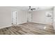 Spacious main bedroom with wood floors, ceiling fan and two doors leading to other areas at 1822 Se 8Th St, Ocala, FL 34471