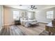 Well-lit main bedroom with hardwood floors, and modern decor provides a serene retreat at 1822 Se 8Th St, Ocala, FL 34471