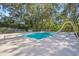 Backyard boasts a sparkling pool with slide and diving board, perfect for summer fun at 1822 Se 8Th St, Ocala, FL 34471