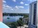 Beautiful lake view featuring a fountain surrounded by lush trees and high rise buildings at 322 E Central Blvd # 1214, Orlando, FL 32801