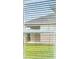 View of backyard from window with blinds at 424 Wayland Dr, Haines City, FL 33844