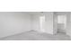Spacious bedroom with grey carpet and access to a bathroom at 424 Wayland Dr, Haines City, FL 33844