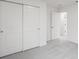 Bright bedroom with carpet and double doors leading to the bathroom at 424 Wayland Dr, Haines City, FL 33844
