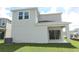 Two-story house with covered patio and grassy yard at 424 Wayland Dr, Haines City, FL 33844