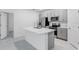 Modern kitchen with gray cabinets, stainless steel appliances, and an island at 424 Wayland Dr, Haines City, FL 33844