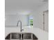 Modern kitchen with gray cabinets, stainless steel appliances and an island at 424 Wayland Dr, Haines City, FL 33844
