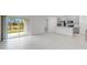 Spacious living area with tile floors, kitchen view, and sliding glass doors at 424 Wayland Dr, Haines City, FL 33844