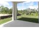 Covered patio overlooking backyard and conservation at 424 Wayland Dr, Haines City, FL 33844