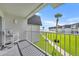 Enjoy ocean views from this bright balcony with white railings and a comfortable chair at 4831 Saxon Dr # 2270, New Smyrna Beach, FL 32169