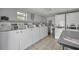Community laundry room with rows of washers and dryers at 4831 Saxon Dr # 2270, New Smyrna Beach, FL 32169
