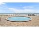 Community hot tub with brick pavers and partial ocean views at 4831 Saxon Dr # 2270, New Smyrna Beach, FL 32169