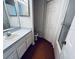 Efficient bathroom featuring white cabinets, sink, toilet, and shower behind a sliding glass door at 570 Cranes Way # 248, Altamonte Springs, FL 32701
