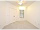 Clean and well-lit bedroom with a neutral carpet, double closet, ceiling fan, and a window at 570 Cranes Way # 248, Altamonte Springs, FL 32701