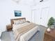 Relaxing staged bedroom with a neutral palette, wood headboard, and soft textures for a calming retreat at 570 Cranes Way # 248, Altamonte Springs, FL 32701