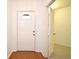 Bright entryway featuring a neutral color palette and wood-look floors, with access to additional rooms at 570 Cranes Way # 248, Altamonte Springs, FL 32701