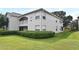 Attractive condo building with manicured landscaping and a charming second-floor balcony at 570 Cranes Way # 248, Altamonte Springs, FL 32701
