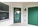 Inviting front entry with glass-paneled door and exterior storage closet, creating a welcoming entrance at 570 Cranes Way # 248, Altamonte Springs, FL 32701