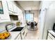 Bright kitchen with modern appliances flowing into a dining area with views, perfect for entertaining at 570 Cranes Way # 248, Altamonte Springs, FL 32701