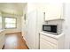 Kitchen showcasing updated appliances, white cabinetry, and an open design at 570 Cranes Way # 248, Altamonte Springs, FL 32701