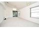Bright living room with sliding glass door and neutral carpet at 570 Cranes Way # 248, Altamonte Springs, FL 32701