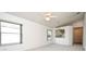 Open-concept living room with multiple windows and a view of the kitchen at 570 Cranes Way # 248, Altamonte Springs, FL 32701