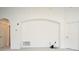 Bright living room with a decorative arch, carpet, and neutral paint at 570 Cranes Way # 248, Altamonte Springs, FL 32701