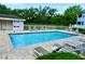Sparkling community pool area with comfortable lounge chairs and well-maintained surroundings at 570 Cranes Way # 248, Altamonte Springs, FL 32701