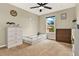 Cozy bedroom featuring a ceiling fan, window, and furniture at 2685 Star Grass Cir, Kissimmee, FL 34746