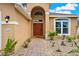 Inviting front entrance with a brick pathway, well-maintained landscaping, and a stylish front door at 2685 Star Grass Cir, Kissimmee, FL 34746