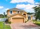 Beautiful home with a well-kept lawn, paved driveway, and an attached two-car garage at 2685 Star Grass Cir, Kissimmee, FL 34746