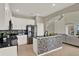 Modern kitchen featuring white cabinetry, stainless steel appliances, and sleek countertops at 2685 Star Grass Cir, Kissimmee, FL 34746