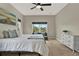 Bright and airy main bedroom with a sitting area, plush carpet, and ample natural light at 2685 Star Grass Cir, Kissimmee, FL 34746