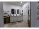 Bathroom with double vanity, decorative mirrors, and storage, creating a functional and stylish space at 3047 Sangria St, Kissimmee, FL 34744