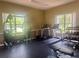 Community gym with various workout equipment and scenic window views at 3047 Sangria St, Kissimmee, FL 34744