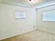 Spacious bedroom with neutral carpeting and two windows at 858 Darwin Dr, Altamonte Springs, FL 32701