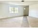 Spacious living room with carpeted floors and large window at 858 Darwin Dr, Altamonte Springs, FL 32701