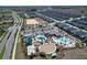 Aerial view showcasing the community's pool, water park, and recreation spaces at 8938 Cabot Cliffs Dr, Davenport, FL 33896