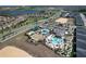 An aerial view of the community showcasing the pools, water park and putt putt golf at 8938 Cabot Cliffs Dr, Davenport, FL 33896