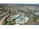 Aerial view of a beautiful resort style community with a golf course, homes, and community clubhouse at 8938 Cabot Cliffs Dr, Davenport, FL 33896