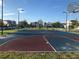 Outdoor basketball court with well-maintained surface, hoops, and surrounding landscaping for active recreation at 8938 Cabot Cliffs Dr, Davenport, FL 33896