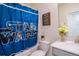 Whimsical bathroom featuring a Star Wars themed shower curtain, clean vanity and neutral walls at 8938 Cabot Cliffs Dr, Davenport, FL 33896