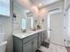 Spacious bathroom featuring double vanity, large mirror, and ample lighting at 8938 Cabot Cliffs Dr, Davenport, FL 33896