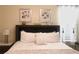 Bright bedroom featuring neutral decor, a king bed, and decorative headboard at 8938 Cabot Cliffs Dr, Davenport, FL 33896