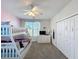 Bright bedroom with bunk beds, closet, and Frozen-themed decor creates a delightful and functional space at 8938 Cabot Cliffs Dr, Davenport, FL 33896