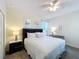 Well-lit bedroom featuring neutral decor, a king bed, and ceiling fan at 8938 Cabot Cliffs Dr, Davenport, FL 33896