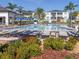 A community pool with lounge chairs and mature landscaping at 8938 Cabot Cliffs Dr, Davenport, FL 33896