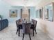 Chic dining room with sleek table setting, modern decor, and bright, airy ambiance at 8938 Cabot Cliffs Dr, Davenport, FL 33896