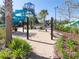 Hammock area between water slides with tropical landscaping at 8938 Cabot Cliffs Dr, Davenport, FL 33896