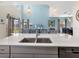 Bright and modern kitchen with granite counters and an open view to the living area at 8938 Cabot Cliffs Dr, Davenport, FL 33896