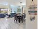 Open-concept living space with high ceilings, tile flooring, and elegant decor at 8938 Cabot Cliffs Dr, Davenport, FL 33896